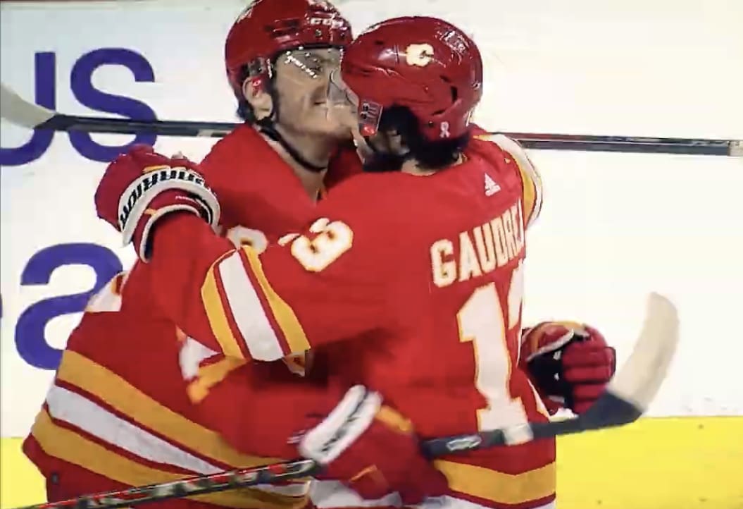 Elias Lindholm and Daniel Vladar of the Calgary Flames celebrates